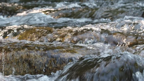 Rushing Rapids.  A Breathtaking 4K 60fps Video of Crystal Clear Mountain River Flow, Capturing the Dynamic Motion and Foaming Waters in Stunning Detail. High Resolution.