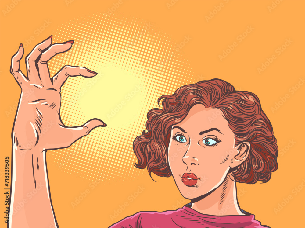 The girl shows the size with her hand. Estimate the size of an object in your head. Small volume in hand. Pop Art Retro The girl shows the size with her hand. Estimate the size of an object in your head. Small volume in hand. Pop Art Retro