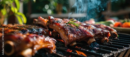 The aroma of the mouthwatering roasted pork ribs filled the air as friends gathered around the barbecue, indulging in the delectable barbecue food. photo