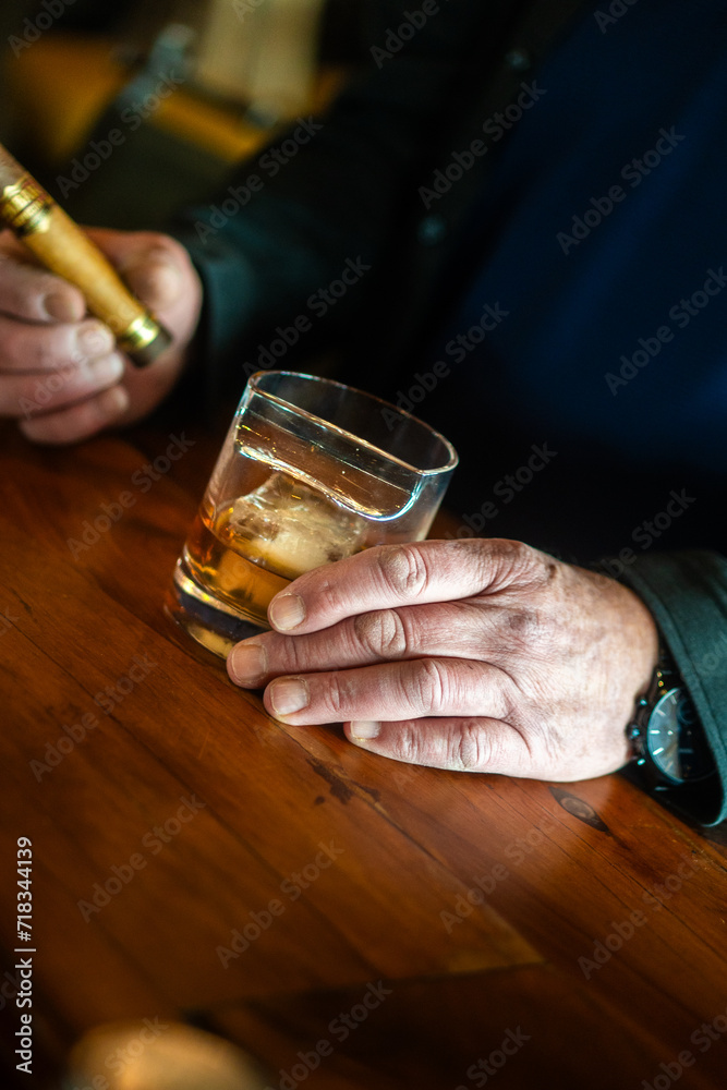 a glass of whiskey in a western bar