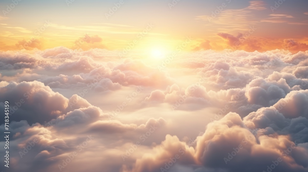  the sun shines through the clouds as it rises above the clouds in the sky in this photo taken from a plane.