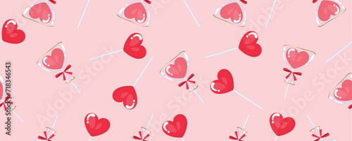 Seamless pattern for design with lollipops in shape of heart on pink background