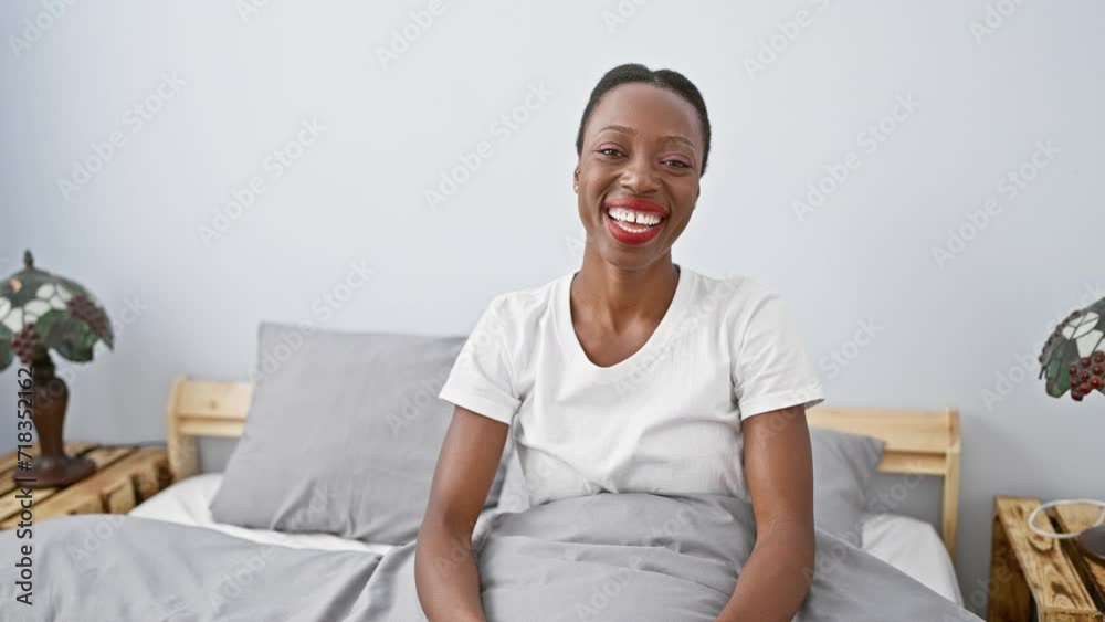 Cheerful african american woman in bedroom offering helping hand, lying comfortably on bed, relaxing and showing positive gesture of support and care Cheerful african american woman in bedroom offering helping hand, lying comfortably on bed, relaxing and showing positive gesture of support and care