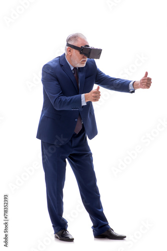Old businessman wearing virtual glasses isolated on white © Elnur