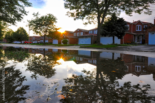 Reflection from pool of water after heavy rainstorm in a residential area in Toronto photo