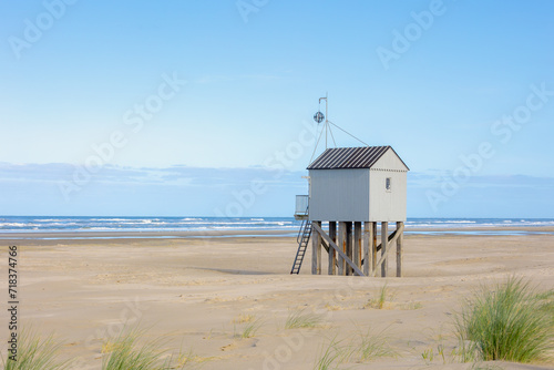 A wooden shelter on high stilts that stands on the North Sea beach (De Drenkelingenhuisje) The Dutch Wadden Sea island Terschelling, Municipality and an island in the northern, Friesland, Netherlands.