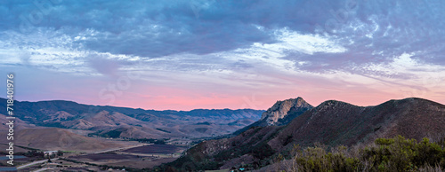 Panorama sunrise, sunset over mountains, hills, sky