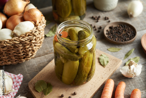 Valokuva Homemade cucumber pickles or gherkins in a glass jar