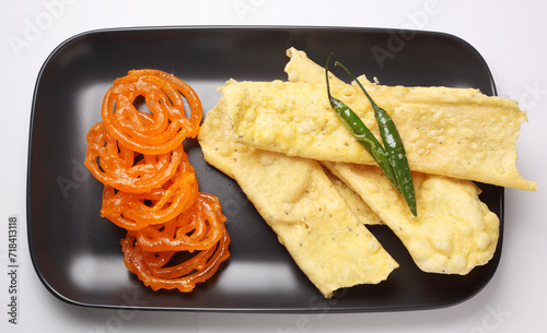 Popular Indian sweet Jalebi and Fafda served with Sambhara. Gujarati snack is mostly eaten during Indian Festivals such as, Gudi Padwa, Dussehra, Eid, Diwali, Mahashivratri, Holi photo