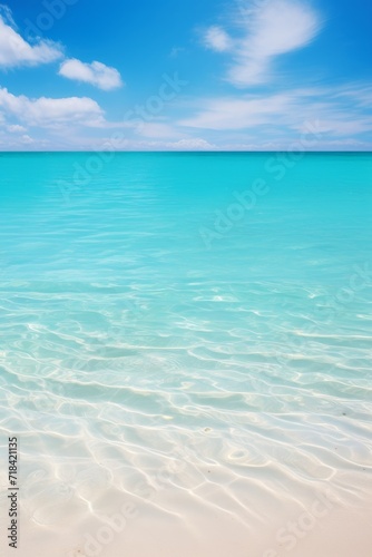 A bright sunny day on an empty beach with crystal clear water AI generated