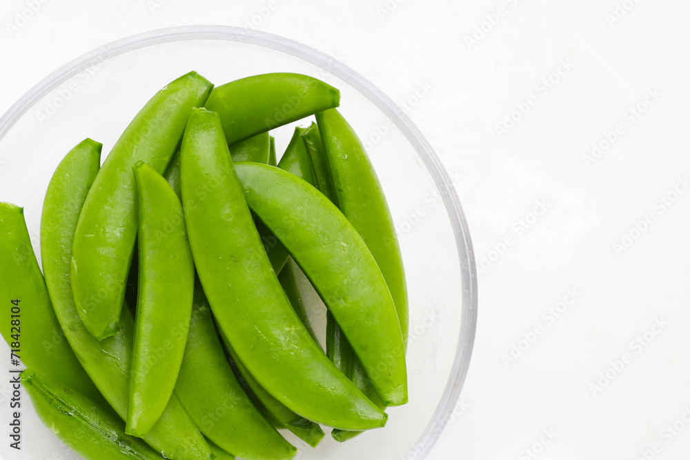 Fresh young green peas on white background. Fresh young green peas on white background.