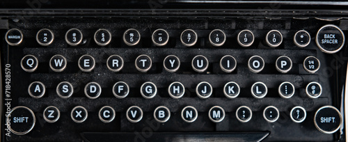 Closeup of an old dusty manual typewriter keyboard photo