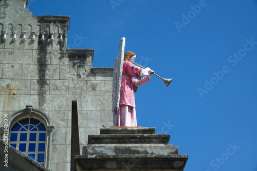 Statue on the roof of the Church of The Monastery of the Holy Eucharist, also known as the Our Lady of Lindogon Shrine and commonly known as the Simala Shrine. photo