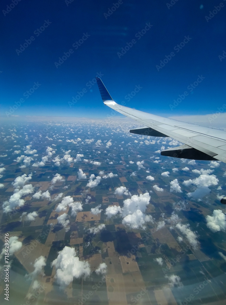 view clouds from airplane window view clouds from airplane window