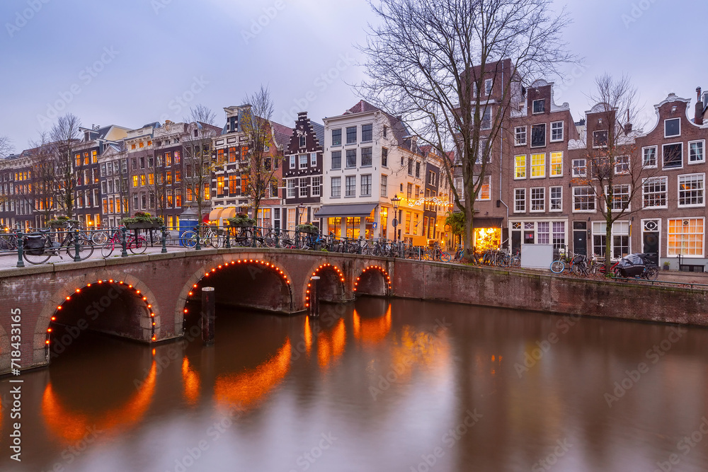 Typical Amsterdam canal with bridge and Dutch houses, Holland, Netherlands.