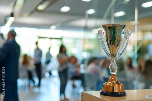 A shining trophy displayed prominently in a bustling office environment