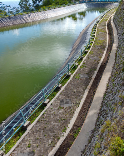 A reservoir on a hill which functions as irrigation as well as a refreshing place photo