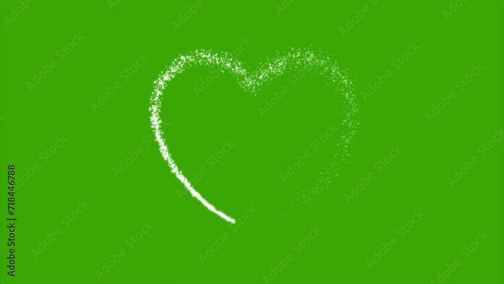 Heart shape formed by glitter particles on green screen background