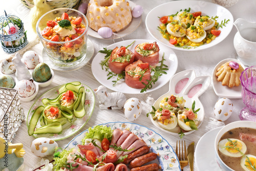 Easter breakfast with vegetable salads, cold cuts and deviled eggs © teressa