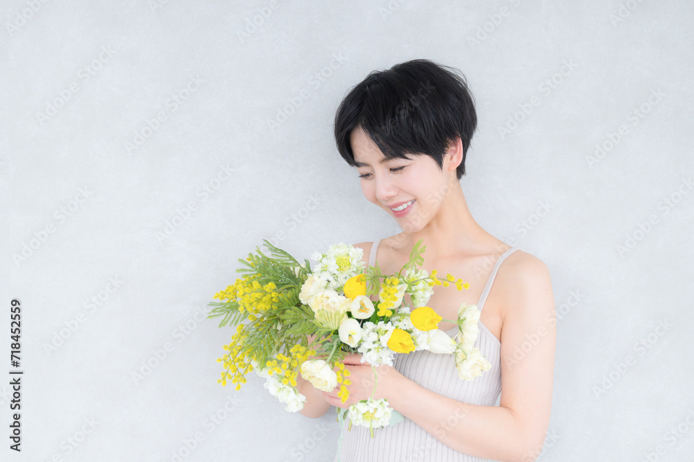 Cute spring beauty image Mimosa and cute Asian (Japanese) woman Cute spring beauty image Mimosa and cute Asian (Japanese) woman