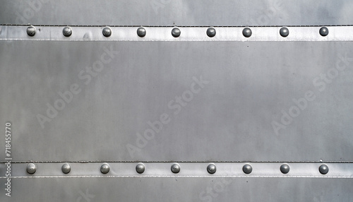 Gray flat sheet metal fastened with rivets with frame for writing messages. Suitable for making background images and banner designs.