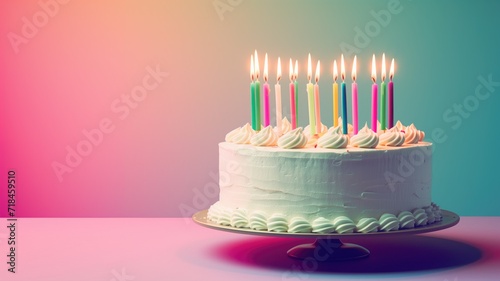 A birthday cake with multicolored candles on a gradient background