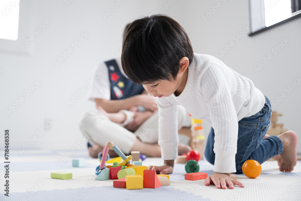 Images of infants playing in nursery schools and other places with male caregivers and babies Images of infants playing in nursery schools and other places with male caregivers and babies
