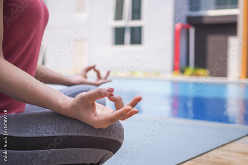 woman practicing meditate in condominium. Asian woman do exercises in morning. balance, recreation, relaxation, calm, good health, happy, relax, healthy lifestyle, reduce stress, peaceful, Attitude..