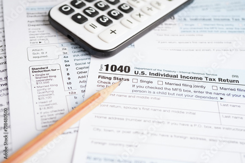 Tax form 1040 U.S. Individual Income Tax Return, business finance concept. © manassanant