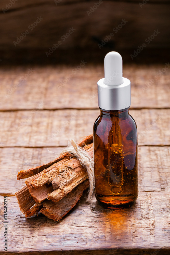 Splinters, powder and essence of cinnamon, on the old table Splinters, powder and essence of cinnamon, on the old table