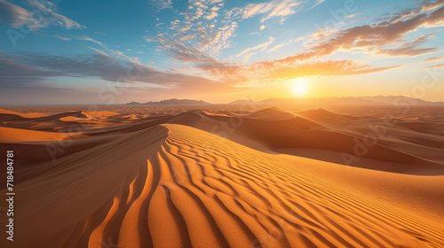 Stunning panorama of vast desert landscape with warm light of sunrise © boxstock production