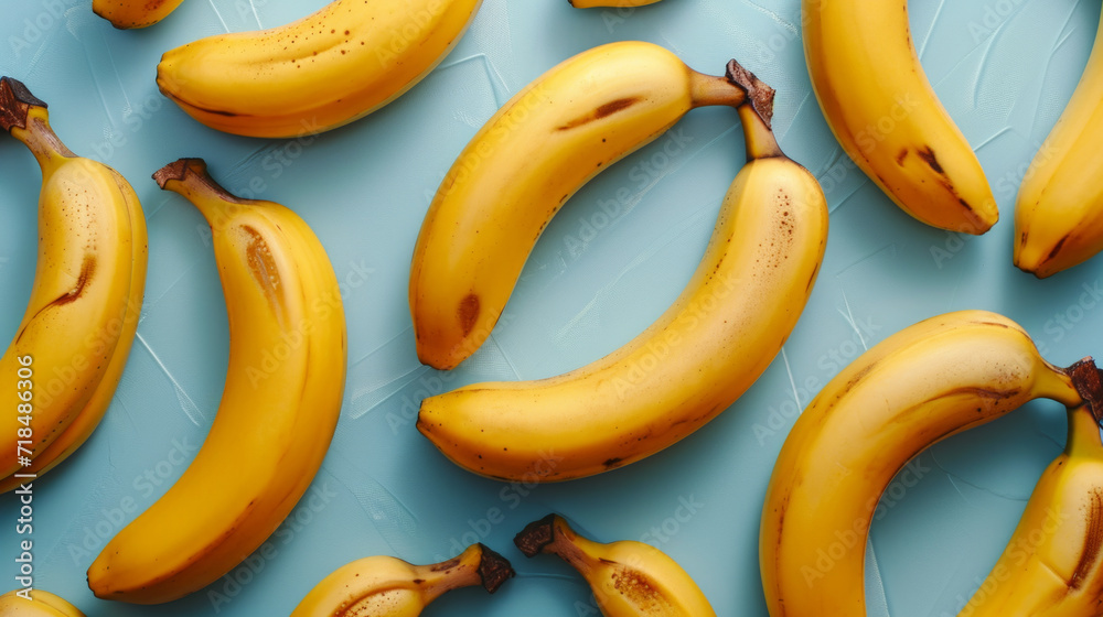 Flat lay of bananas on light blue background. From top view. Flat lay of bananas on light blue background. From top view.