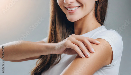 Caucasian woman's arm, emphasizing clean and healthy skin during a beauty care routine indoors