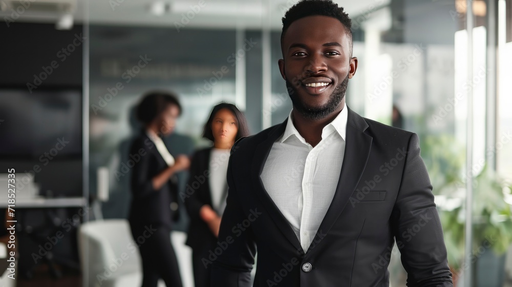 Handsome cheerful african executive black business man at the workspace office