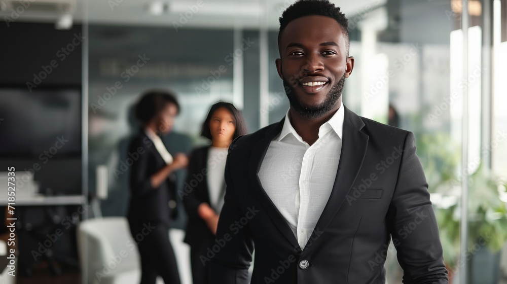 Handsome cheerful african executive black business man at the workspace office Handsome cheerful african executive black business man at the workspace office