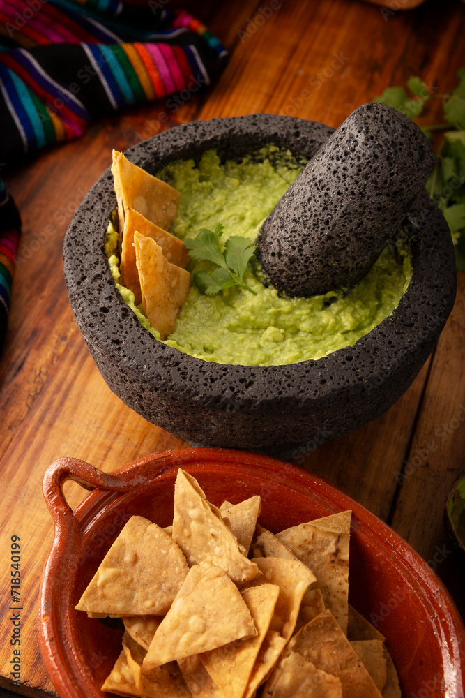 Guacamole. Avocado dip with tortilla chips also called Nachos served in