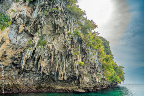 Granite marble rock structure surface of natural mountain's cliff and cave, the beautiful sea  in Andaman Sea, Koh Waen, Koh Chueak, Trang Thailand. photo