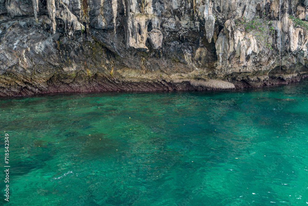 Granite marble rock structure surface of natural mountain's cliff and cave, the beautiful sea in Andaman Sea, Koh Waen, Koh Chueak, Trang Thailand. Granite marble rock structure surface of natural mountain's cliff and cave, the beautiful sea in Andaman Sea, Koh Waen, Koh Chueak, Trang Thailand.