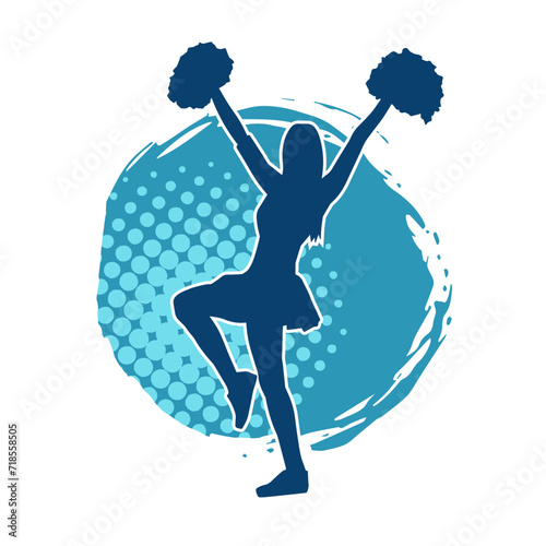 Silhouette of a female cheerleader carrying pompom while dancing