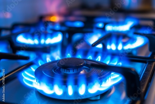 Blue kitchen gas stove flame in kitchen.