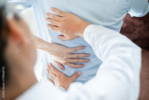 Female physiotherapists provide physical assistance to women patients with back injuries back massages for relaxation and muscle recovery in the rehabilitation center