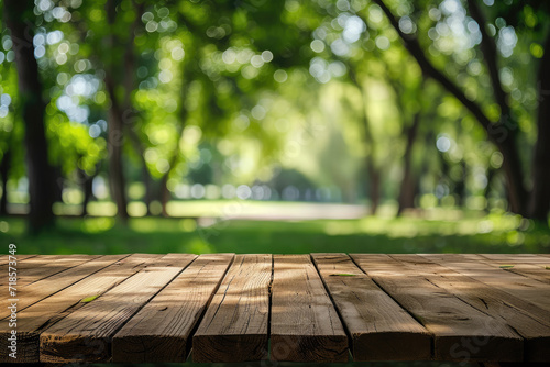 Blurred background wooden table in park with natural forest trees