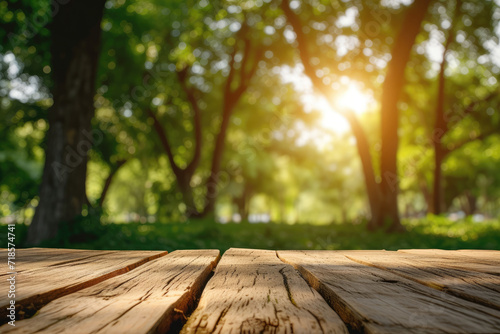 Blurred background wooden table in park with natural forest trees