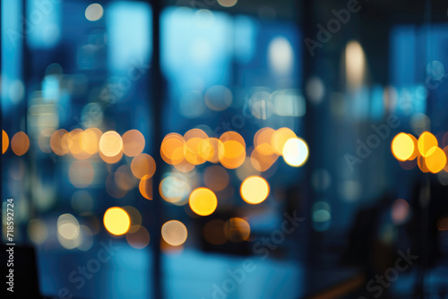 Blurred office interior space background in the workplace with computer shallow depth of focus of abstract background, night time © ty