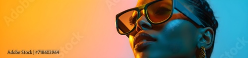 face of a woman with sunglasses on a colorful background
