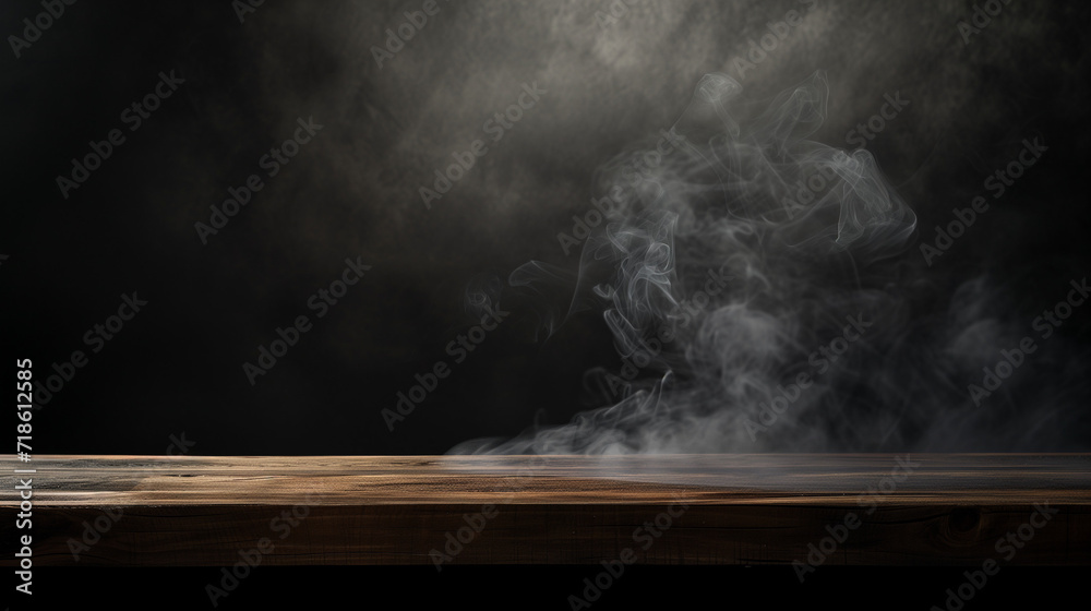 On a black background, an empty wooden table with smoke floats up. Empty space for displaying your products, with a smoke float up on a dark background.