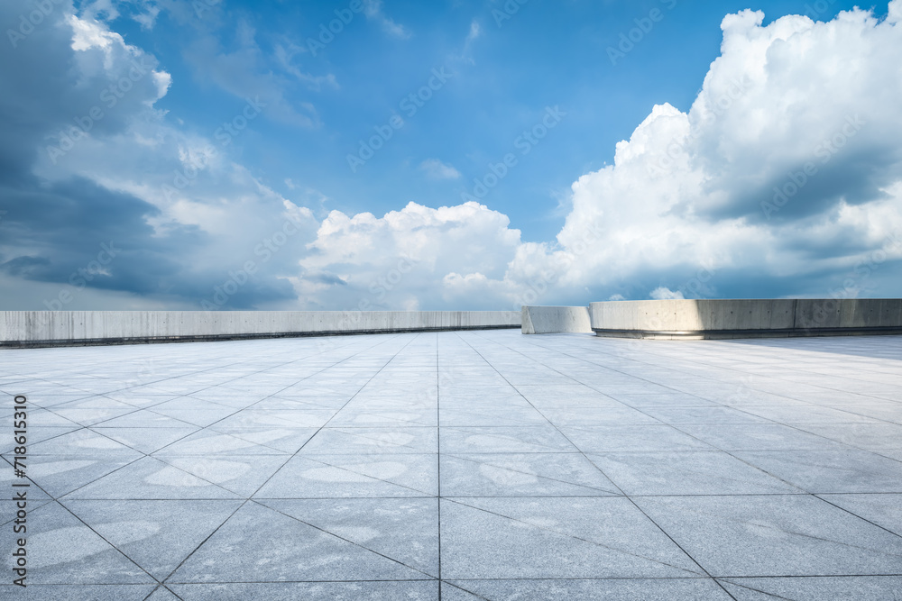 Empty brick floor and sky clouds background