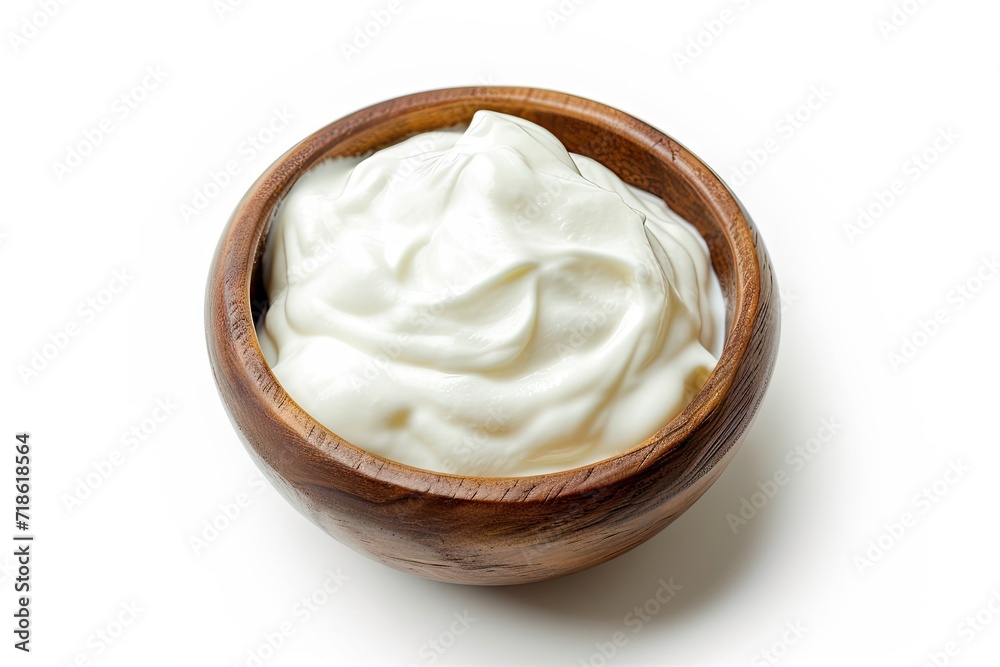 Isolated top view of a wooden bowl with sour cream or yogurt on white background Isolated top view of a wooden bowl with sour cream or yogurt on white background