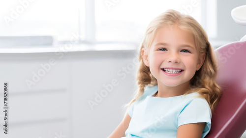 Banner with little blonde girl in dentist chair looking satisfied with treatment  on blurred background with space for text. Children s dentistry  routine checkup  no fear of treatment and pain