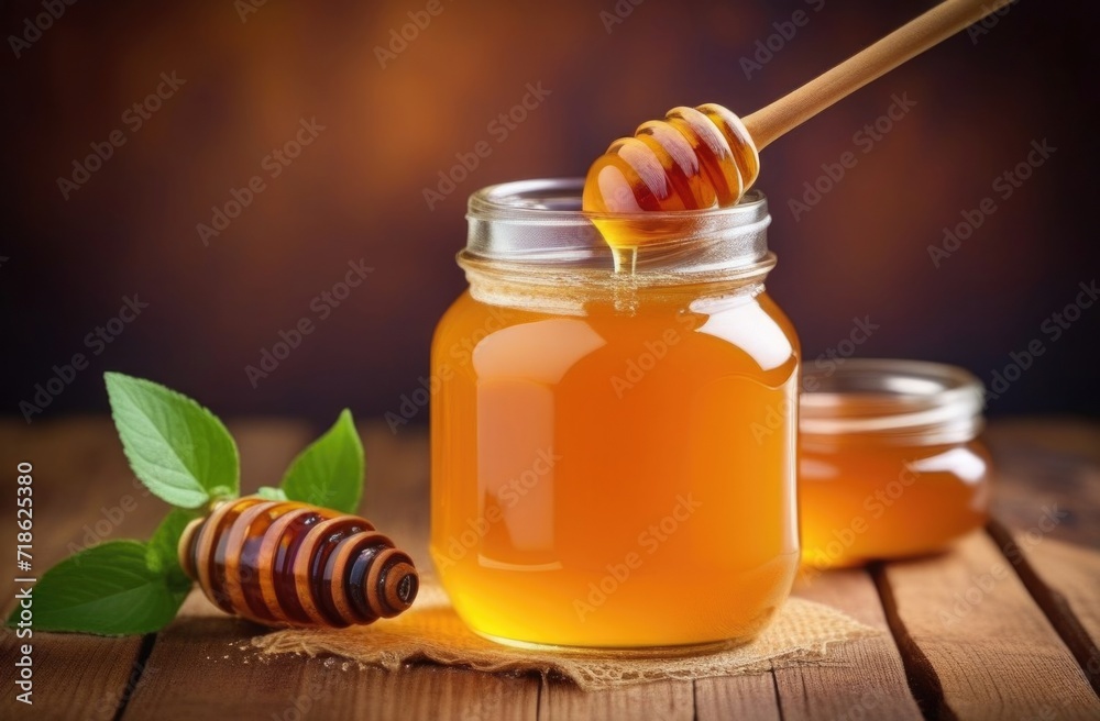 Honey with wooden honey dipper on wooden table. Honey with wooden honey dipper on wooden table.